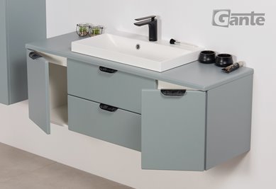 Miętowa szafka łazienkowa wisząca z białą umywalką nablatową czarny uchwyt 120 cm Magnolia